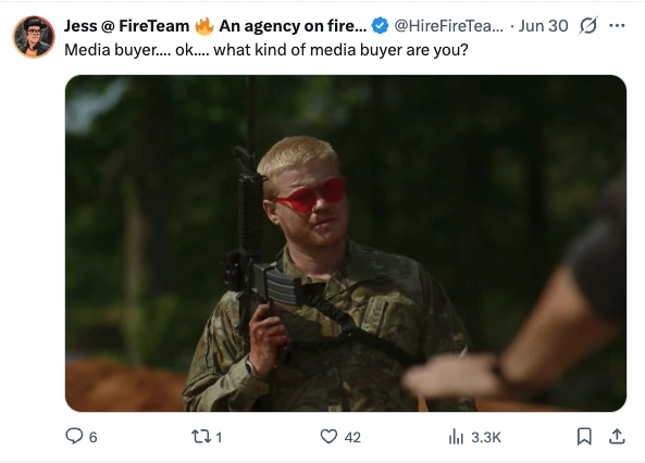 Post by Jess at FireTeam, 30 June 2026: Media buyer.... ok.... what kind of media buyer are you? Attached is a still of a young man in camouflage holding a rifle and wearing bright red wraparound sunglasses.